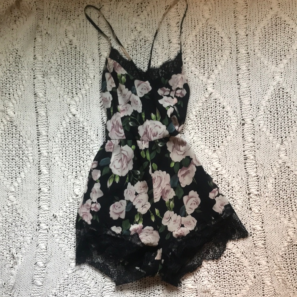Black floral lace trim romper with criss cross zipper back